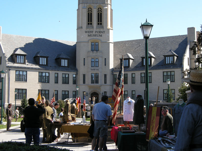 Outside facing the front of the West Point Museum with people gathered in front.